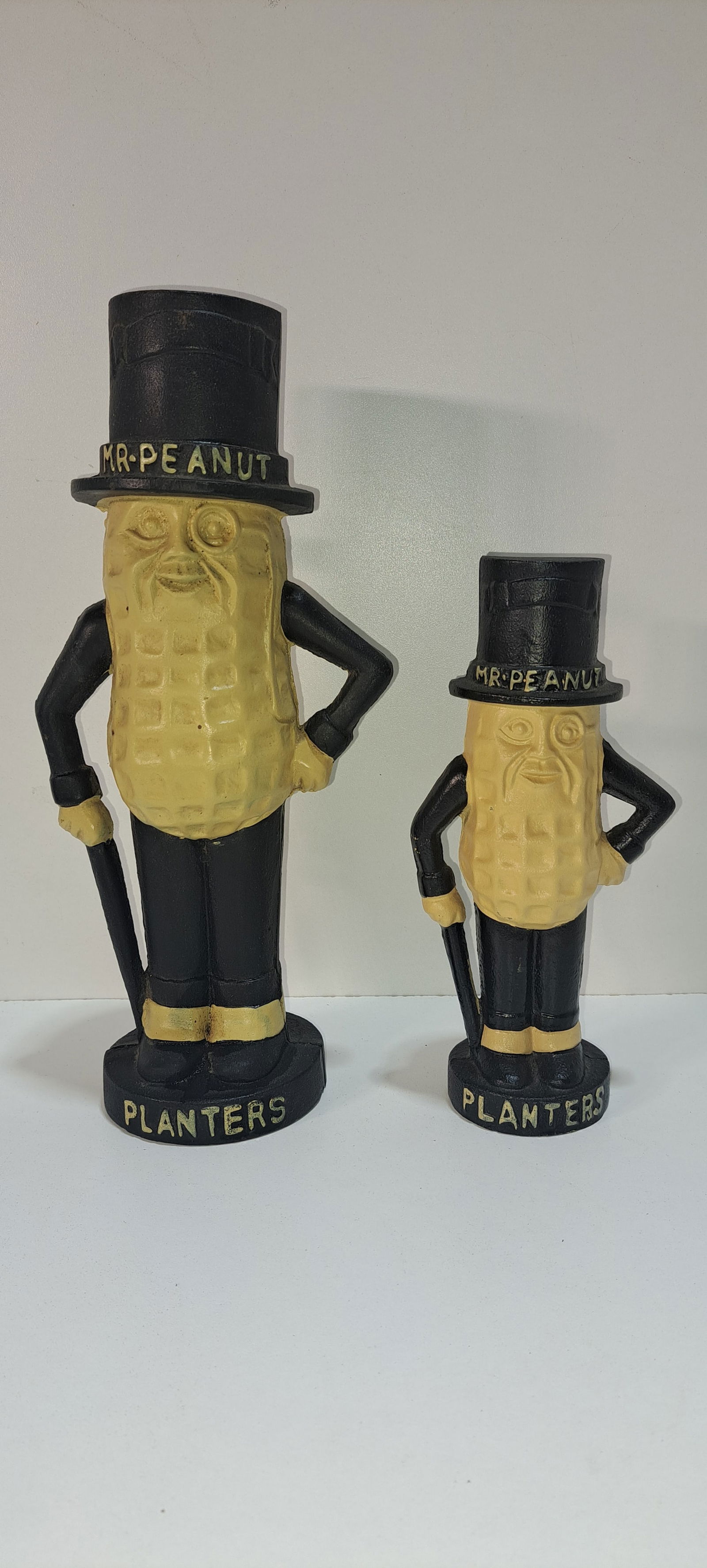 (2) Mr. Peanut cast iron banks: 2 cast iron, figural, Mr. Peanut coin banks, (not old), very good condition, 1 approx. 11.5" tall, 1 approx. 8" tall, Please note: if picking up, location is different than auction location. Please co