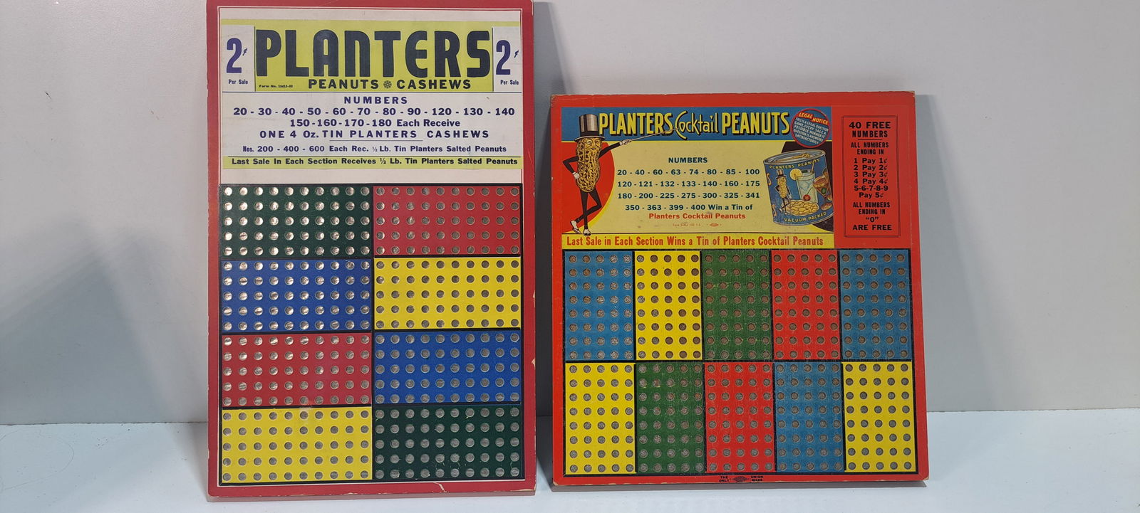 (2) Planters Peanuts punchboards: 2 Planters Peanuts punchboards, one unpunched with punch on back, other missing punch and has been punched from behind but remains intact on the front side, one approx. 8.75" x 13.5" one 10.25" x 10.7