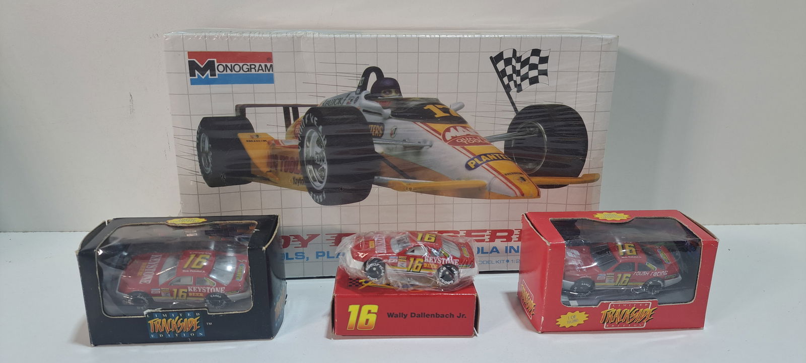 (4) modelrace cars: lot of 4 cars, one plastic kit car, 3 small model cars, all advertising different companies, including: Planters Peanuts, Keystone Beer, Mac Tools, etc., all in original boxes in excellent condition,