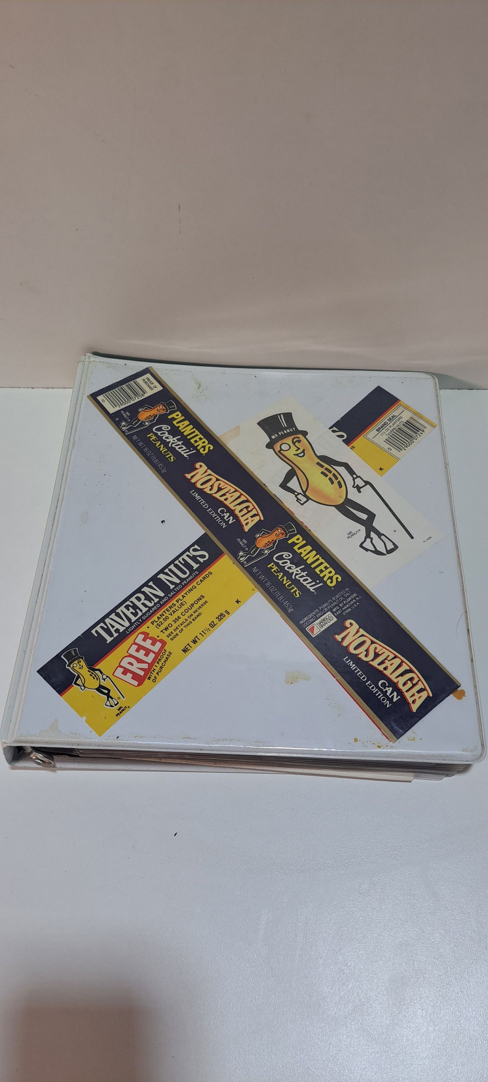 binder full Planters Peanuts: 3 ring binder with many empty bags from Planters Peanuts, multiple products, sizes and age, plus other Planters related paper, binder approx. 10.5" x 11.5" x 1.75", good condition, Please note: if pic