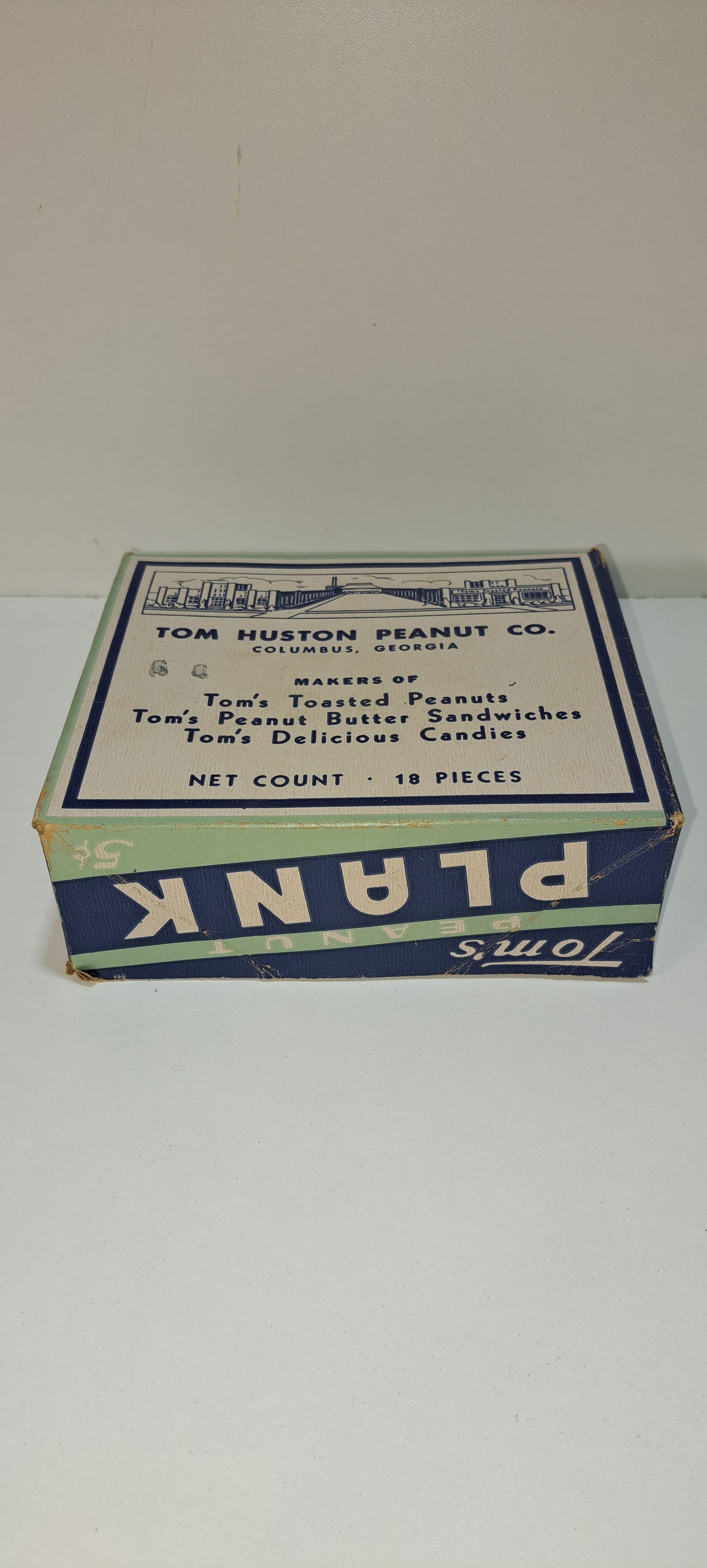 Tom's Peanut Plank box: cardboard display box for Tom's Peanut Plank 5 cent, lid shows factory and product list, held 18 pieces, minor wear, overall good condition, approx. 5.5" x 6.25" x2.25", Please note: if picking up, lo