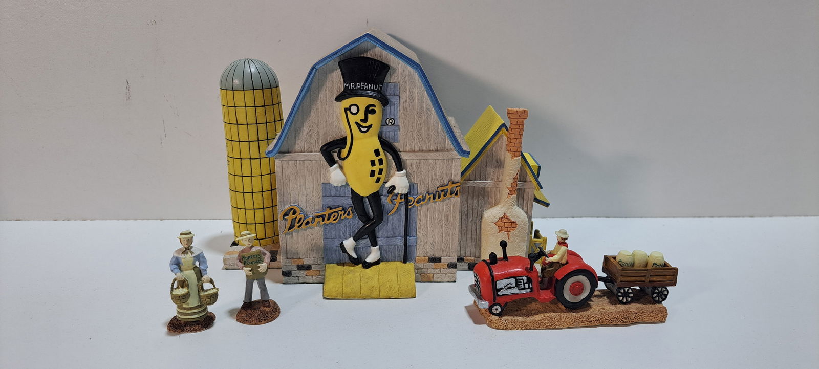 Planters Peanuts farm set: 4 piece, ceramic, barn, tractor, man and woman, barn has large Mr. Peanut on both sides, Nabisco Collectors Classics, all in excellent condition, no damage, barn is approx. 6.25" tall, Please note:
