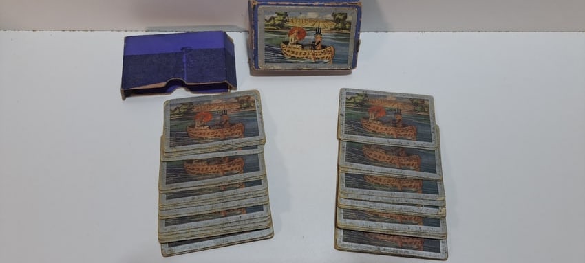 early Planters Peanuts playing cards: early deck of Planters Peanuts playing cards with Mr. Peanut rowing a peanut shaped canoe and a pretty lady with a parasail, in original box, cards show excessive wear as does box, with damage, 52