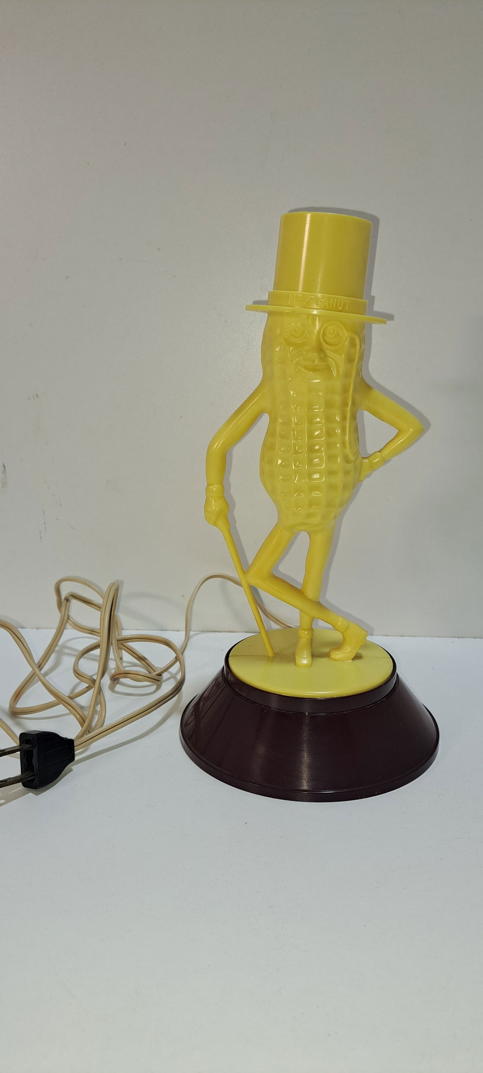 Mr. Peanut night light: plastic, figural, Mr. Peanut night light in hard to find yellow color with maroon base, very good working condition, does have 2 small melt marks on bottom of base in the rear as pictured, approx. 9.5