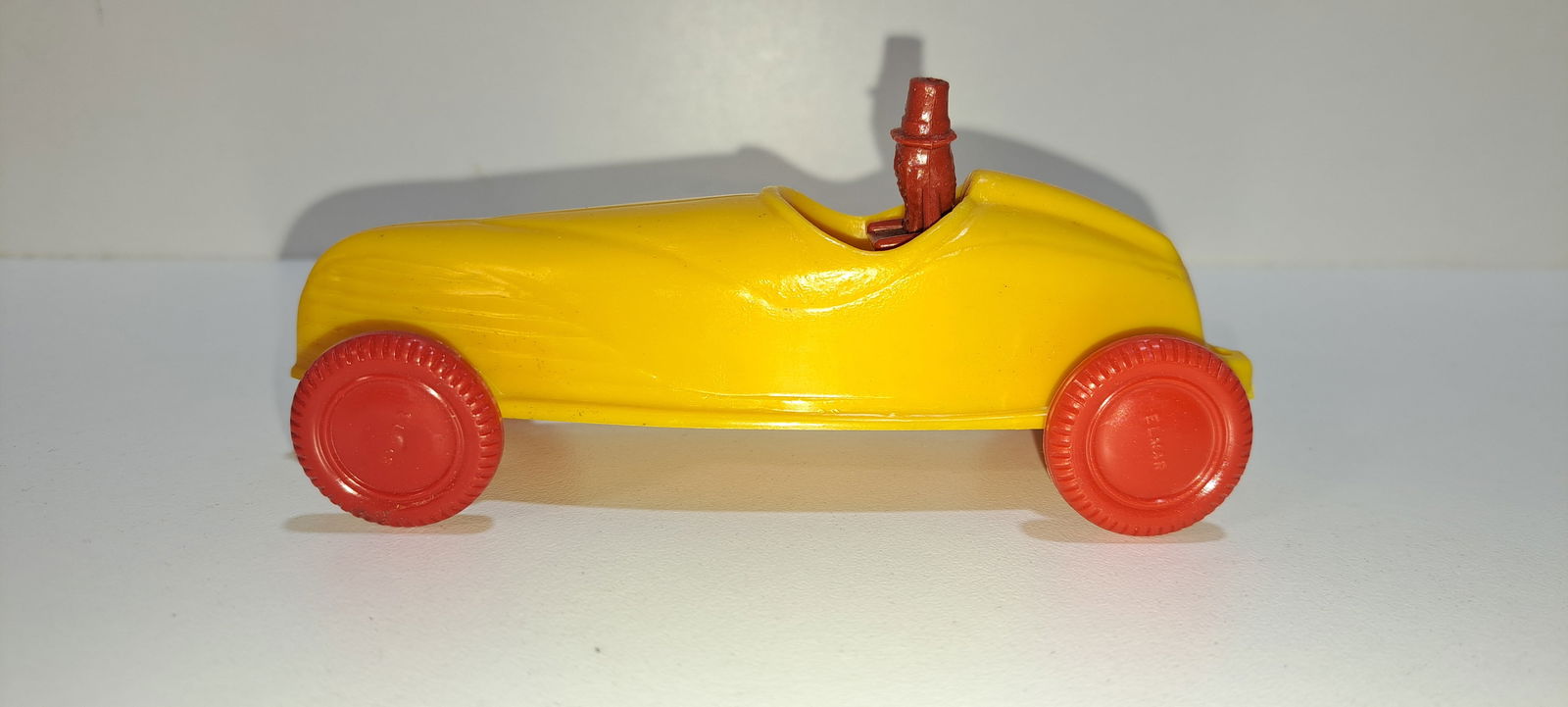 Mr. Peanut jet racer: yellow, plastic, Elmar jet racer with red Mr. Peanut driving, and red wheels, very good condition, approx. 5.25" long, Please note: if picking up, location is different than auction location. Please