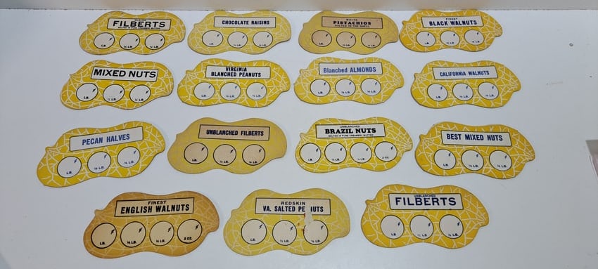 (15) peanut shaped price cards: lot of 15 different peanut shaped price cards for various products, made from cardstock, used in Planters Peanuts stores, unused, some have wear, most in good condition, each approx. 3" x 6", Please
