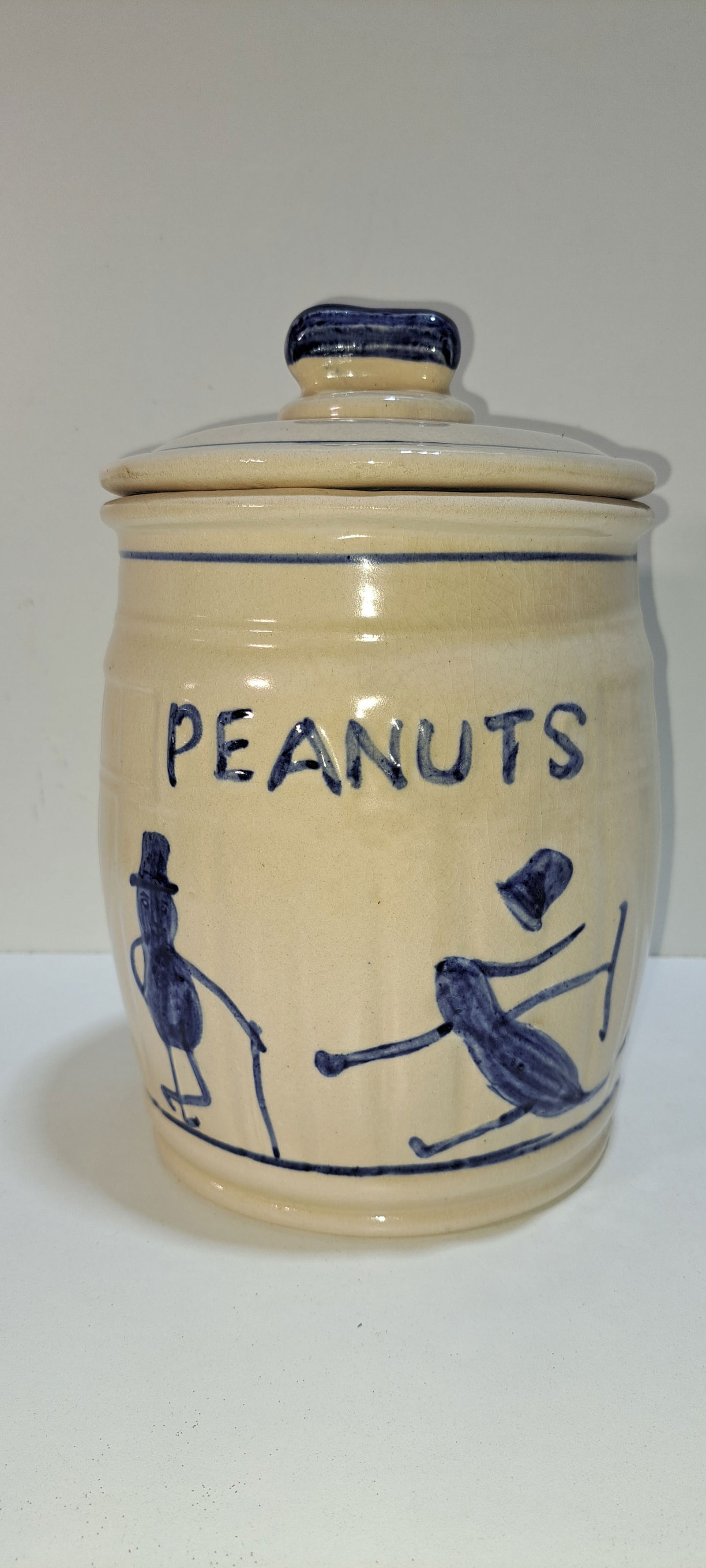 ceramic peanut jar: smaller, barrel shaped, ceramic, peanut jar, with images of a Mr. Peanut, correct lid with peanut shaped handle, this is a fantasy jar and not original, very good condition with no chips or cracks, cr