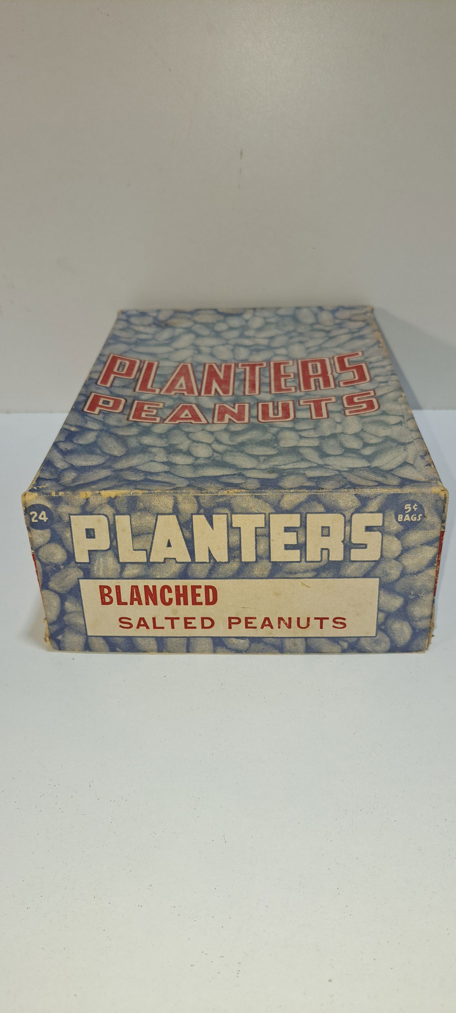 Planters Peanuts display box: Planters Peanuts, cardboard display box with lid, showing peanuts throughout and Mr. Peanut, held 24-5 cent bags of blanched salted peanuts, shows some wear, approx. 6.25" x 9" x 3", Please note: if p