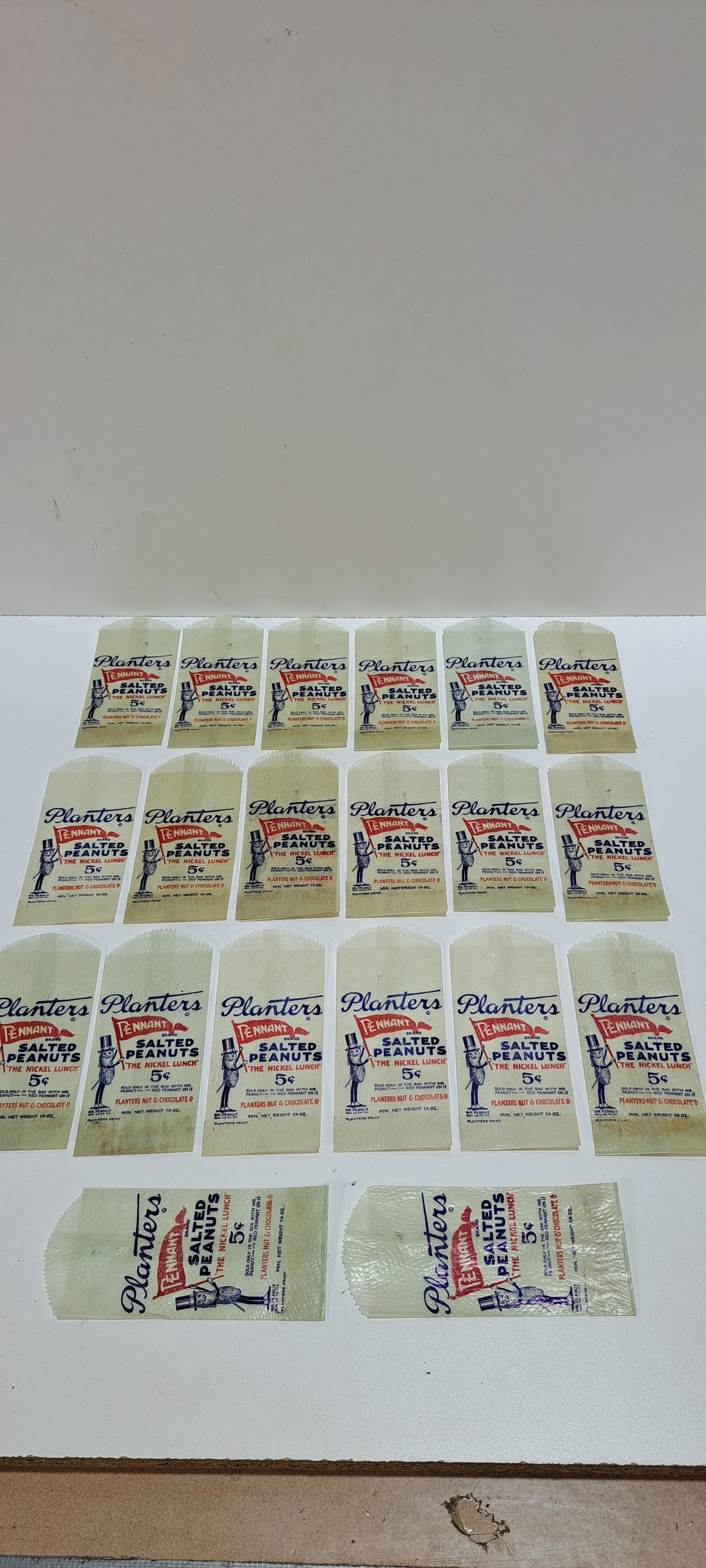 (20) Planters Peanuts bags: lot of 20, new old stock, Planters Peanuts, 5 cent, glassine peanut bags, nice graphics, all in good condition, each approx. 2.75" x 5.75", Please note: if picking up, location is different than aucti