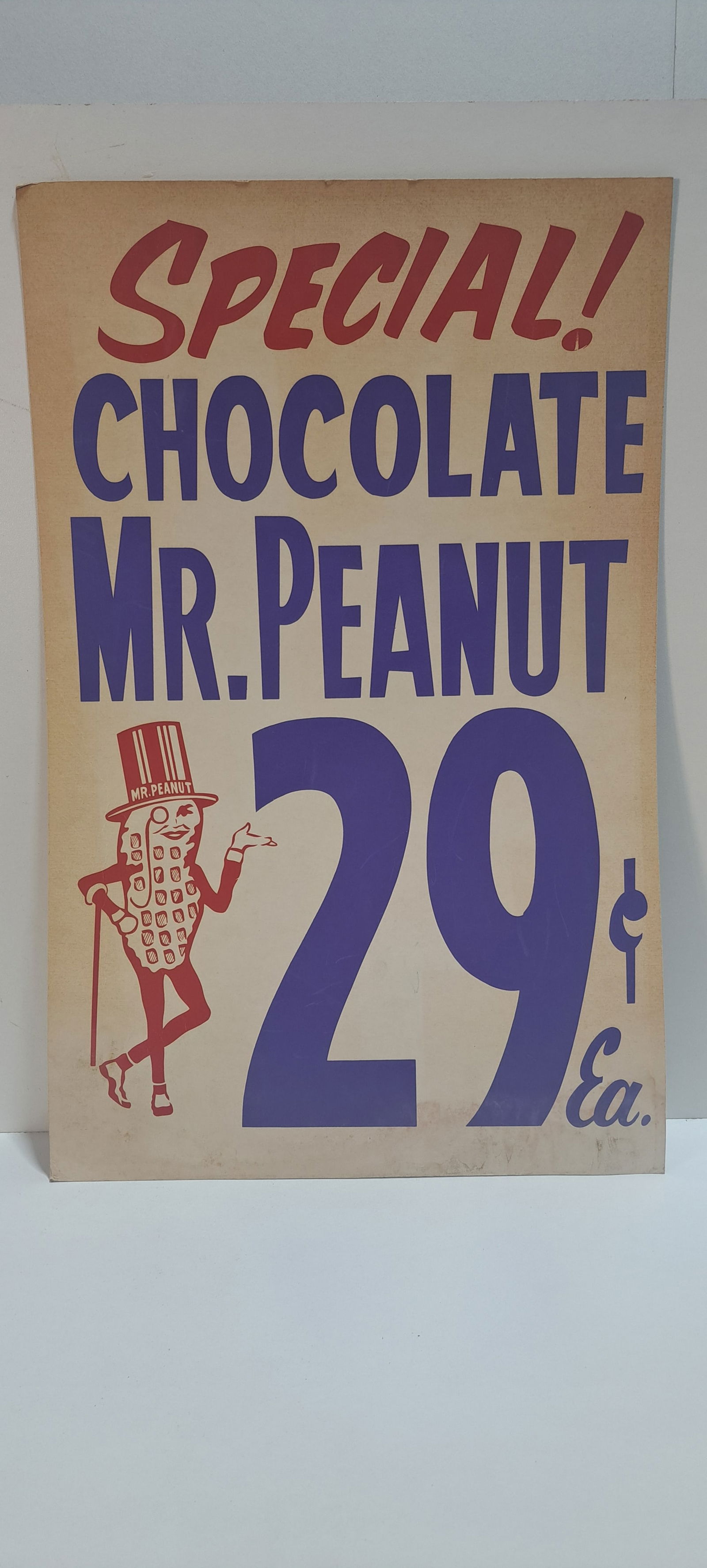 chocolate Mr. Peanut sign: cardboard sign advertising chocolate Mr. Peanut for 29 cents, shows minor wear with slight water stain at bottom, strong color, approx. 14" x 22", Please note: if picking up, location is different