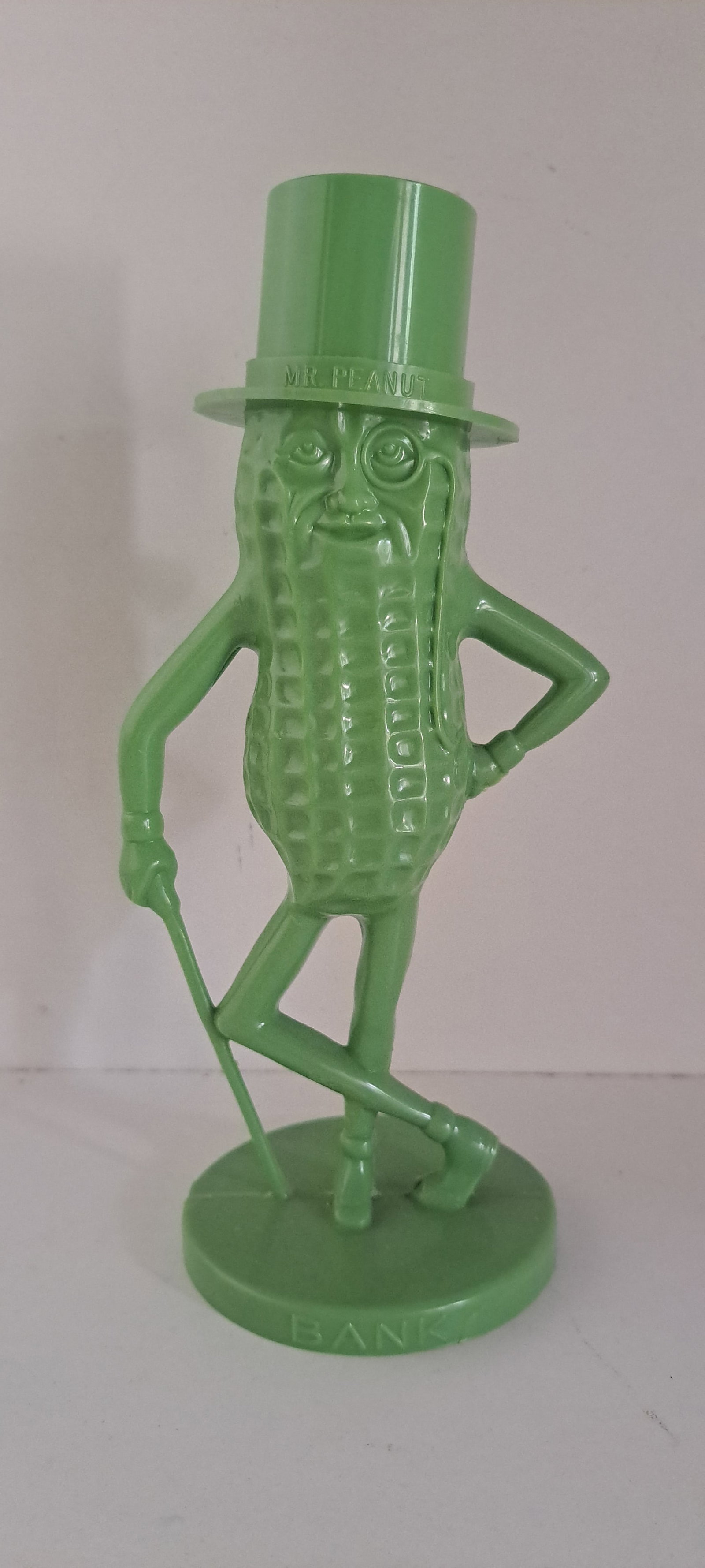 Mr. Peanut lime green bank: Mr. Peanut, figural, plastic, coin bank in hard to find, lime green color. Removeable hat. Very good condition, with no chips or cracks. Approx. 8.5" tall. Please see our shipping policy for options.