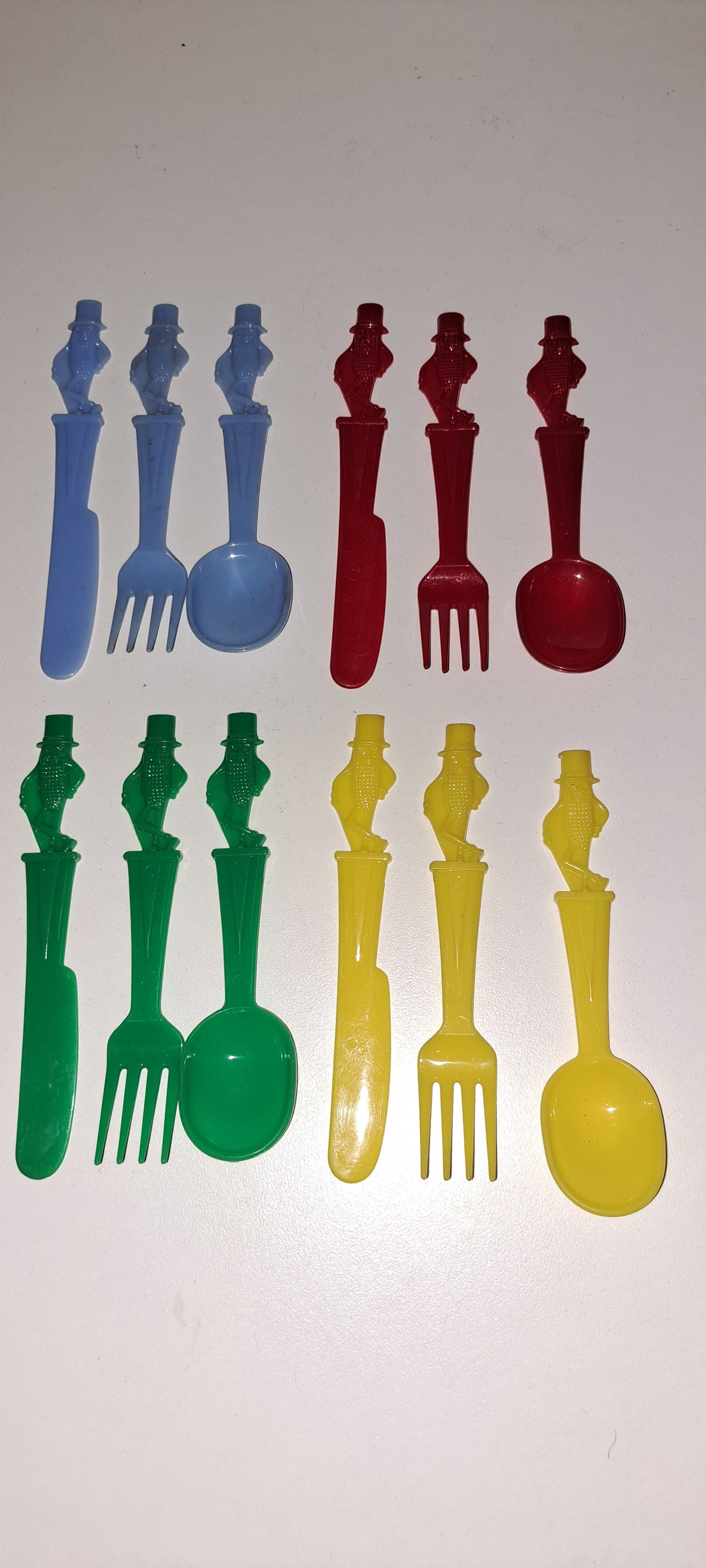 Mr. Peanut children's utensils: 4 plastic, children's, knife, fork, and spoon sets. Mr. Peanut handles. In blue, red, green, and yellow. All in very good condition. Please see our shipping policy for options.