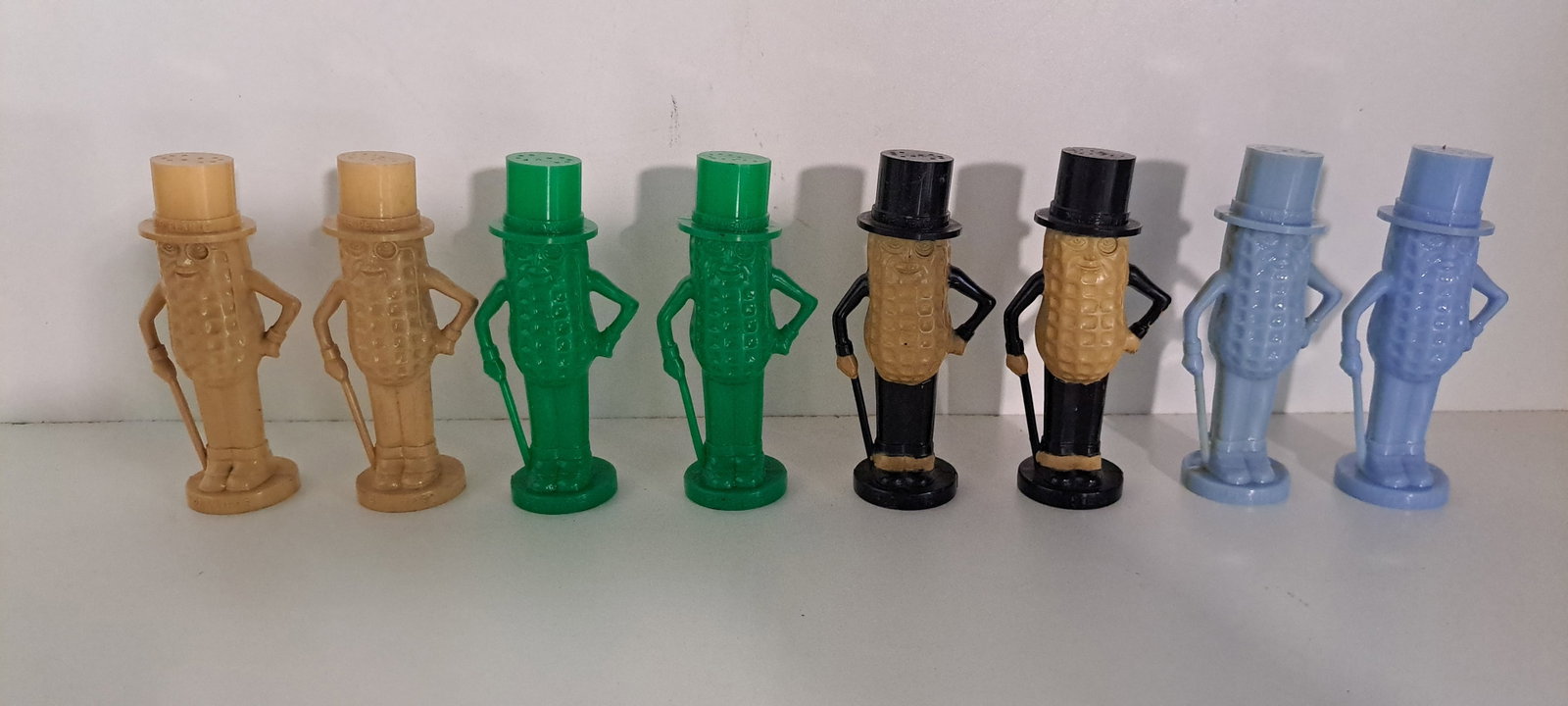 Mr. Peanut salt & pepper shakers: 4 sets of plastic, figural, Mr. Peanut salt and pepper shakers. Good condition, with minor wear. Each approx. 4" tall. Please see our shipping policy for options.