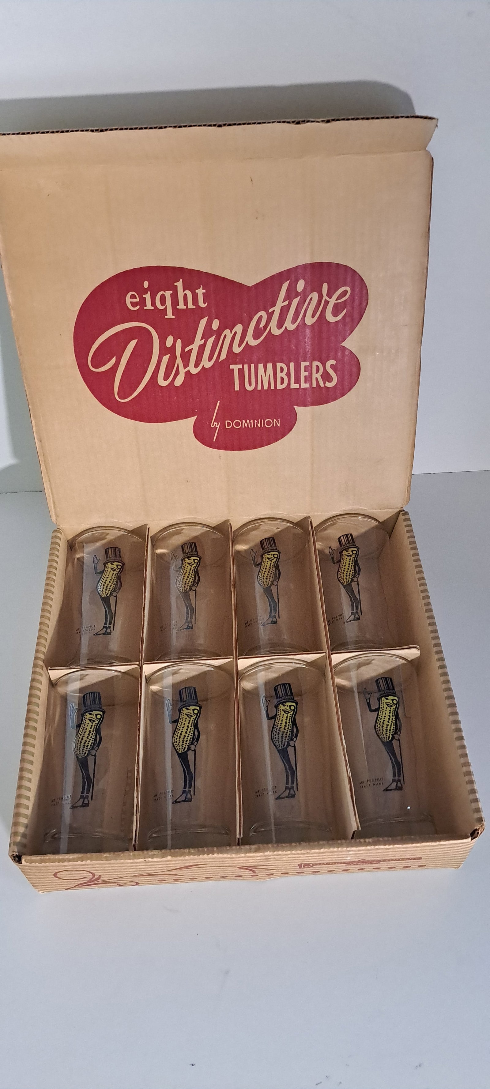 Planters Peanuts Canadian set of drinking glasses: Set of 8 Canadian, glass tumblers. Each with early Mr. Peanut. Made by Dominion. In original cardboard box. Each glass approx. 5.5" tall. Excellent condition. Please see our shipping policy for option