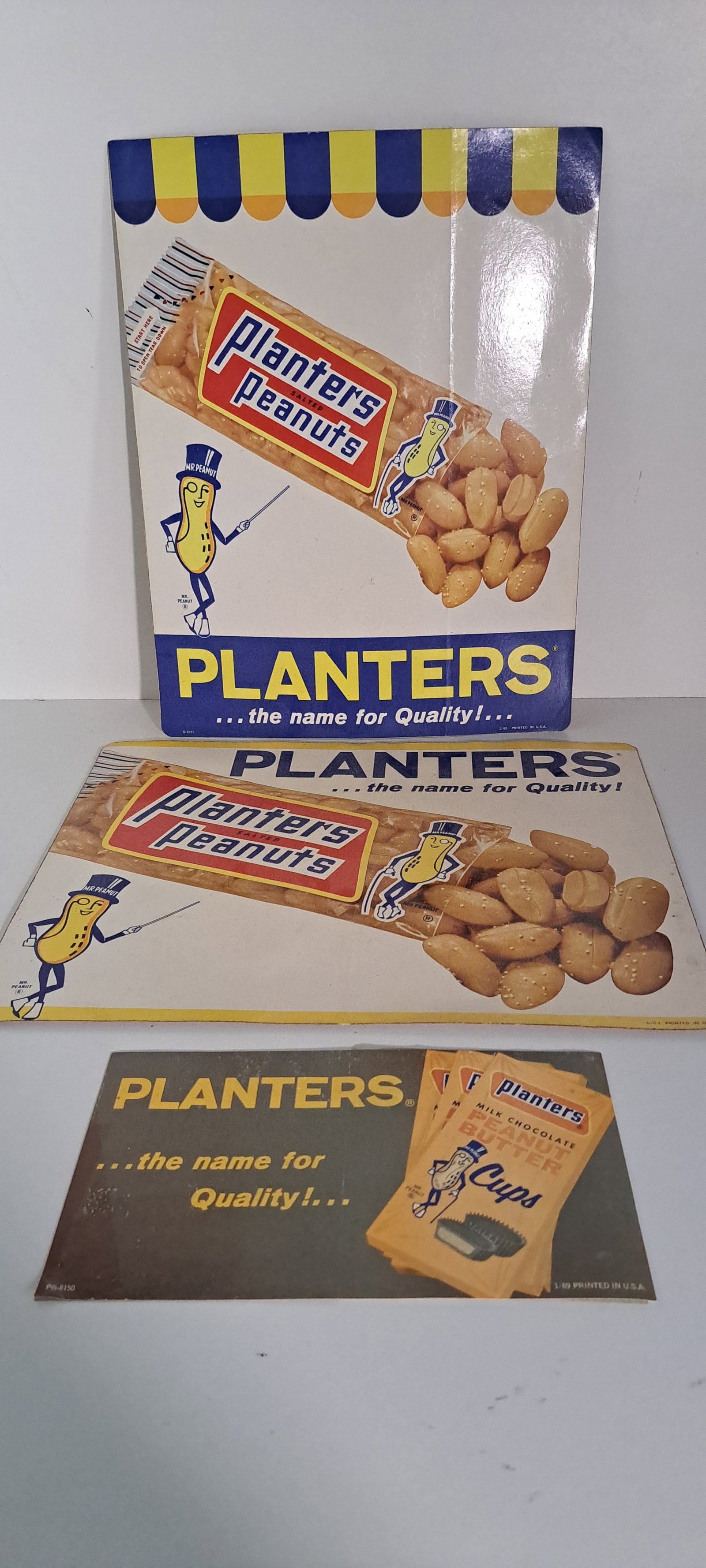 (3) Planters Peanuts decals: Lot of 3 different Planters Peanuts decals. Each with Mr. Peanut. All Standard Brand era, and dated. !965 & 1969. 2 larger decals in good condition, smaller one has some wear. Sizes are Approx. (2) @