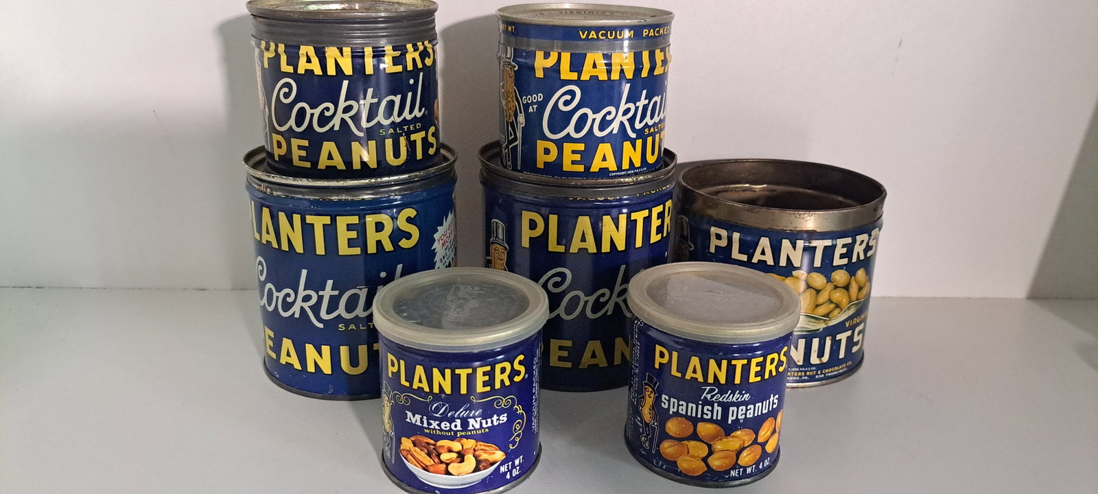 (7) Planters Peanut tins: Lot of 7 Planters Peanut tins. All are empty, one is missing the lid. Show minor wear, overall good condition. Please see our shipping policy for options.