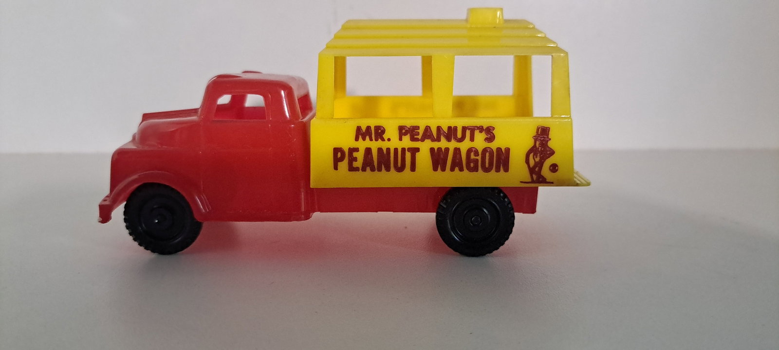 Mr. Peanut plastic peanut wagon truck: Mr. Peanut's Peanut Wagon, red and yellow plastic truck. very good condition. Approx. 5.5" long. Please see our shipping policy for options.