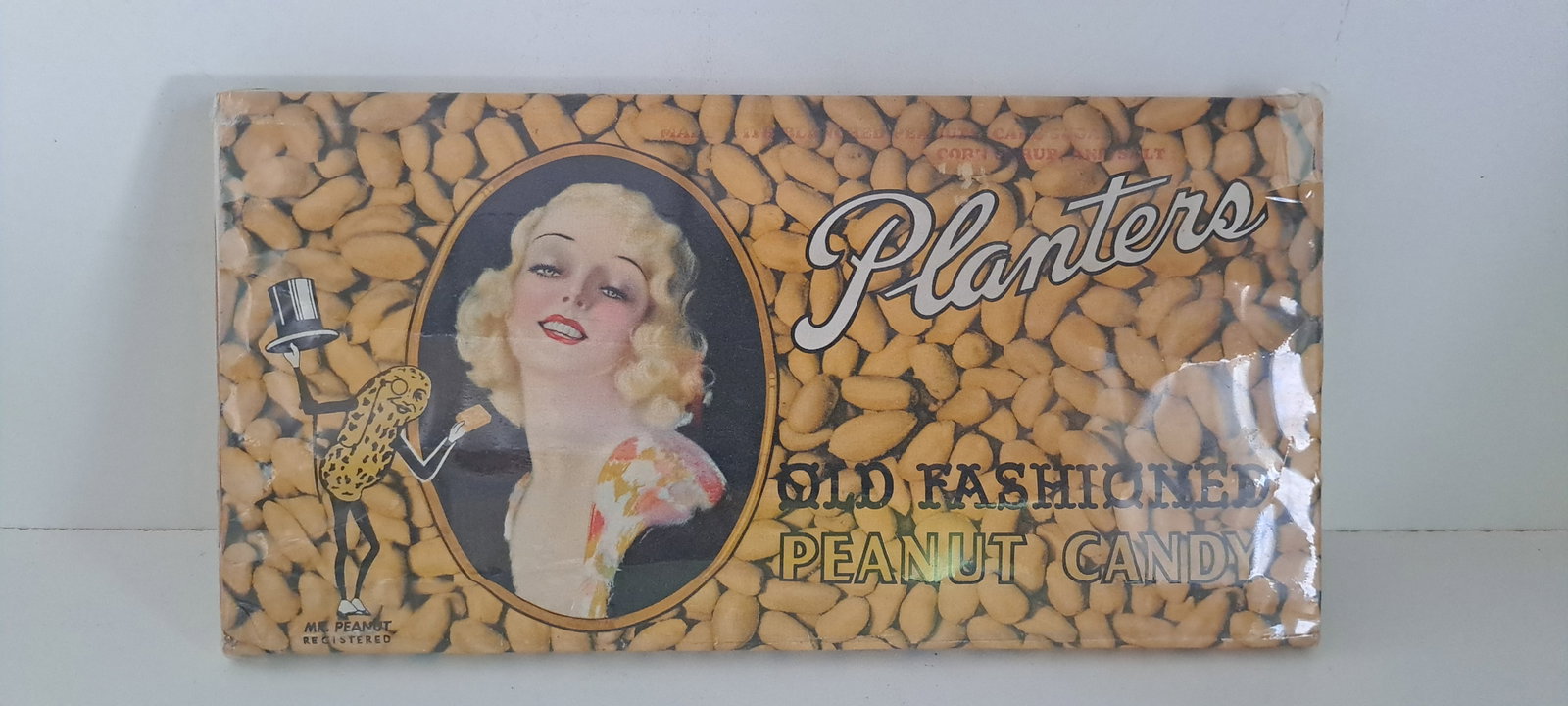Large Planters Peanut candy dummy bar: Early and rare, large Planters Peanuts, Old Fashioned Peanut Candy dummy bar. This is a hard to find display that was made using a wrapper over a piece of wood. This was done by Planters to help sell 