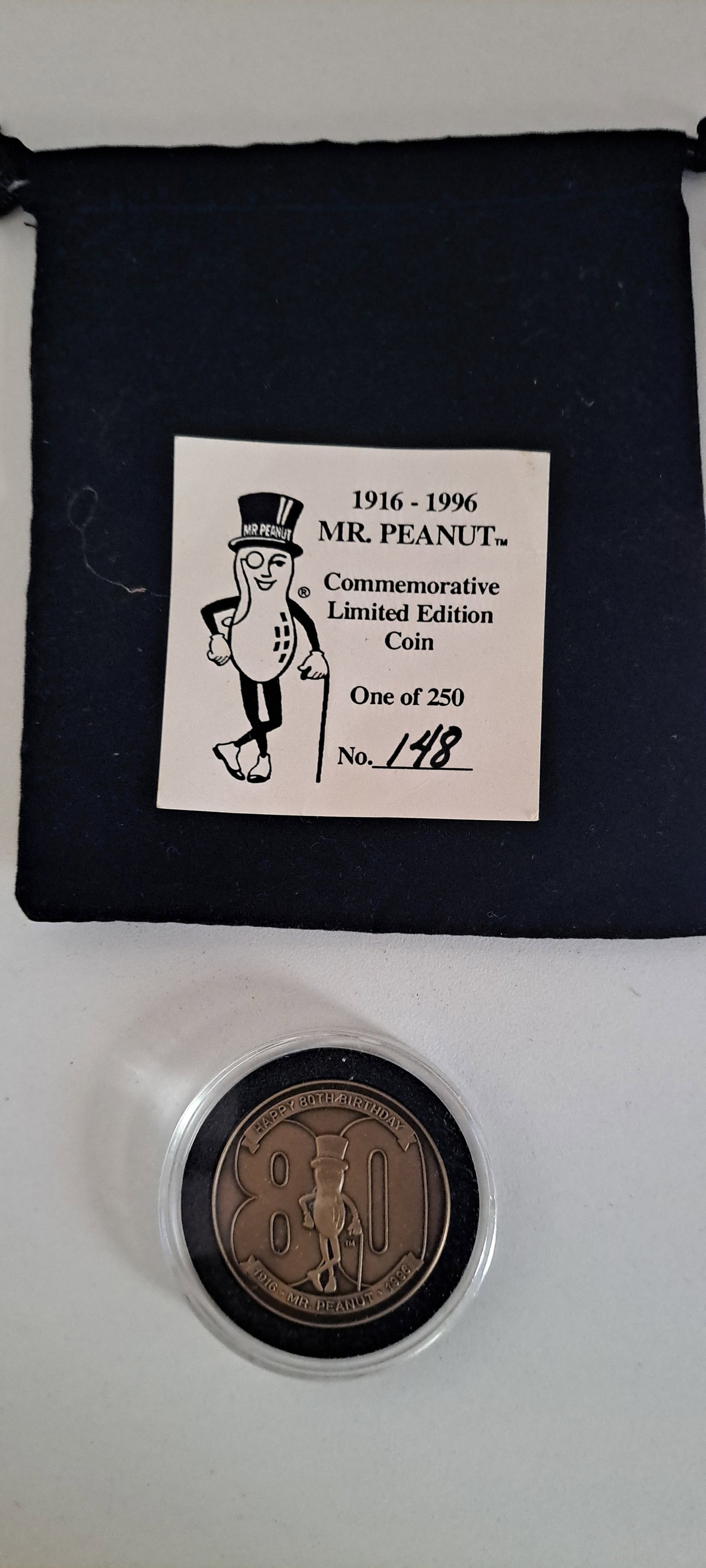 Mr. Peanut commemorative coin: Mr. Peanut 80th birthday, commemorative coin. #148 of 250. in original case and black velvet pouch, with card. coin is double sided. Excellent condition. Please see our shipping policy for options.