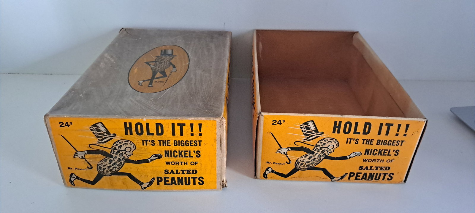 Planters Peanuts display box: Early and rare, Planters Peanuts, cardboard, display box, with lid. Great graphics with running Mr. Peanut. Missing display flap Lid has split corner. Box shows some wear, but has strong color. Approx
