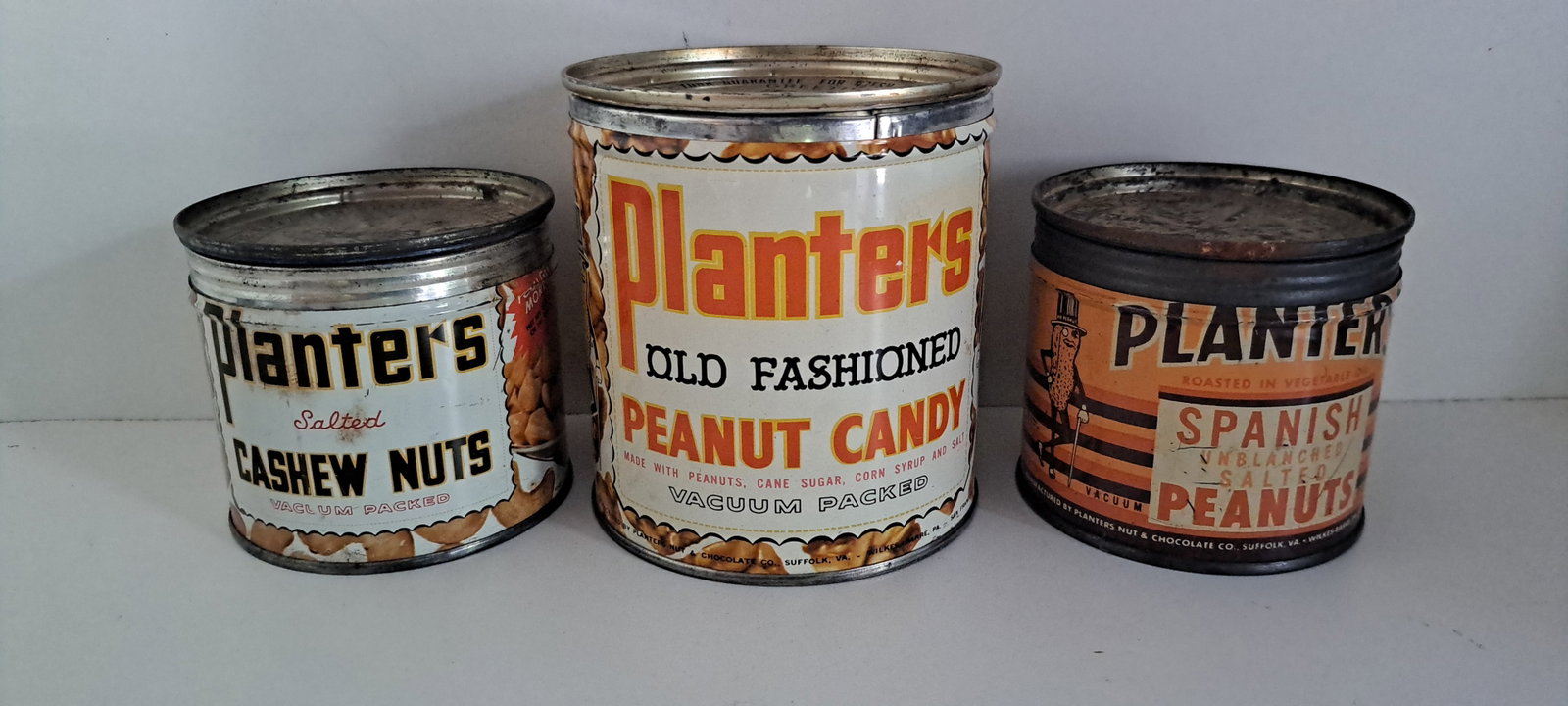 (3) Planters Peanuts tins: Lot of 3 different, Planters Peanuts tins. Each empty, with lids. Show wear. Please see our shipping policy for options.