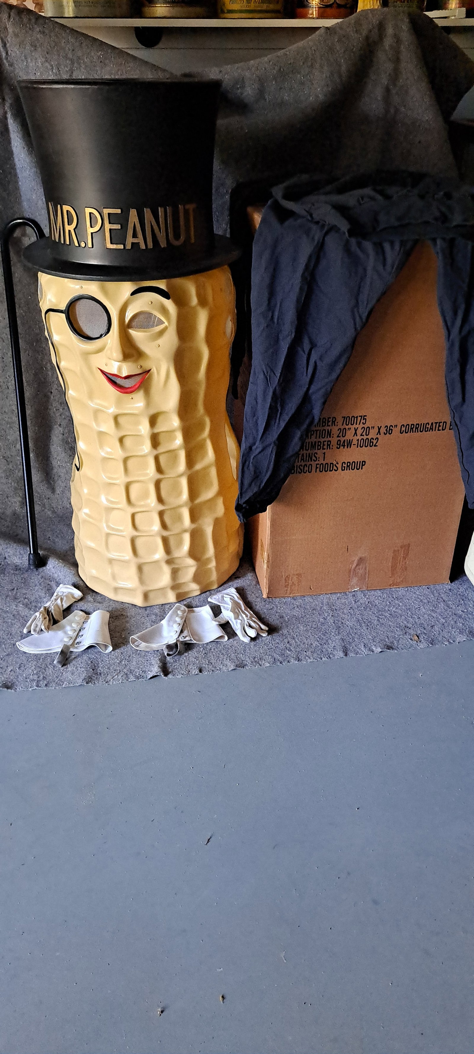 Mr. Peanut parade mask: Mr. Peanut plastic parade mask. Complete, in original box with black shirt and pants, white gloves and spats, and cane. Hat is removeable. Has a few cracks that have been repaired with heavy tape