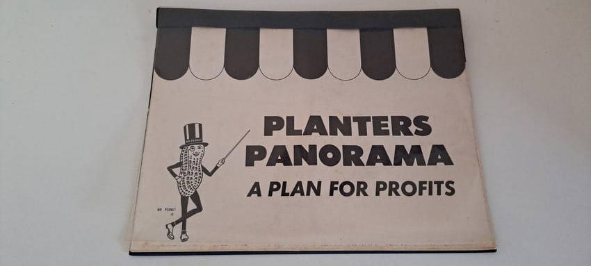 Planters Peanuts sales booklet: Planters Panorama, sales display portfolio. Shows interesting pictures of product displays for the salesman to show the store manager. 11 pages in the folder. Shows minor wear. Approx. 8.5" x 11".