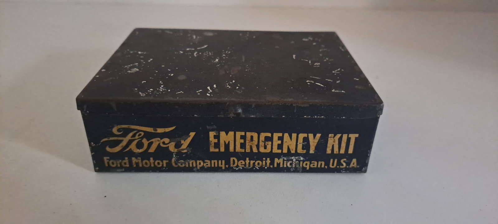 Early Ford emergency kit: Early, Ford, Emergency Kit, tin. Empty, Approx. 4" x 5" x 1.5". Minor wear and scratches, fair condition. Please see our shipping policy for options.