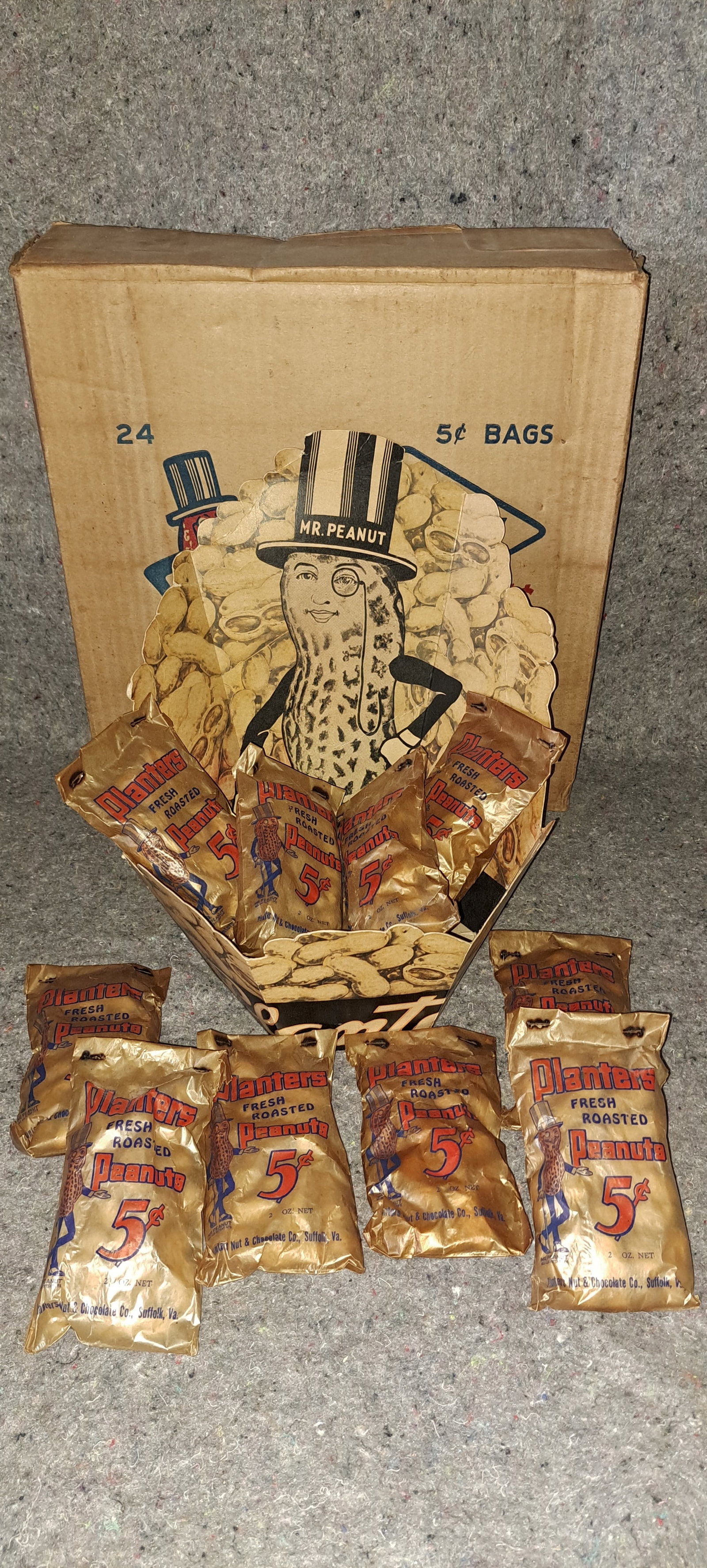 Rare Planters Peanuts cardboard display: Very rare, Planters Peanuts, Cardboard display. Great graphics with Mr. Peanut and script lettering. Comes with original cardboard shipping box, as well as 13 sealed bags of peanuts. Shipping box is a