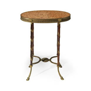 A Louis XVI style gilt-bronze mounted table, late 19th: A Louis XVI style gilt-bronze mounted table late 19th century After the model by Adam Weisweiler. H: 28 1/2 in. W: 23 1/2 in. PROVENANCE: Private Collection, New York, NY.