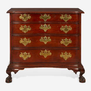 A Chippendale carved mahogany oxbow chest of drawers Boston, MA, circa 1780: A Chippendale carved mahogany oxbow chest of drawers Boston, MA, circa 1780 Top with chamfered edge, the front with ball-and-claw feet, the back with ogee feet. (H: 33 in. W: 36 in. D: 21 1/2 in.) 