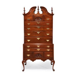 A Queen Anne carved cherry bonnet-top high chest Connecticut, circa 1775: A Queen Anne carved cherry bonnet-top high chest Connecticut, circa 1775 With shell-carved drawer to upper and lower case. (H: 88 in. W:42 1/4 in. D: 22 1/2 in.) ProvenanceBy direct descent in the