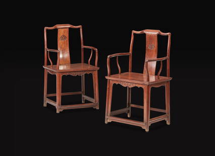 A pair of Chinese huanghuali continuous yoke-back armchairs, Nanguanmaoyi, Qing Dynasty 黃!: A pair of Chinese huanghuali continuous yoke-back armchairs, Nanguanmaoyi, Qing Dynasty 黃花梨南官帽椅一對 清 With boldly-carved crest rail