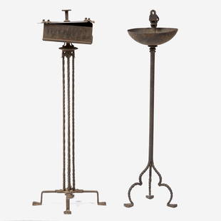 Two Gothic Revival wrought iron smoking stands, early 20th century Both on paw-form feet. H: 33: Two Gothic Revival wrought iron smoking stands, early 20th centuryBoth on paw-form feet.H: 33 ½ in. (tallest)ProvenanceHarold Pitcairn (1897-1960) and Clara (Davis) Pitcairn (1896-1964) of Bryn