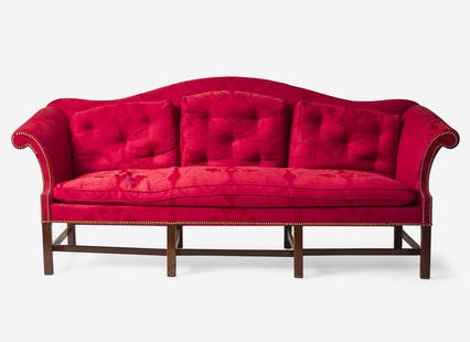 An impressive Chippendale camelback mahogany sofa with red damask upholstery, possibly 18th century: An impressive Chippendale camelback mahogany sofa with red damask upholstery, possibly 18th century and later With arched backrest, scrolled arms, on straight legs with stretchers. H: 40 in. W: 90 in.
