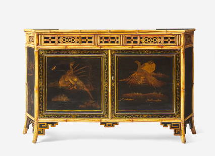 A French Japanesque bamboo and lacquer sideboard, 20th century Of trapezoidal form, with pierced: A French Japanesque bamboo and lacquer sideboard, 20th century Of trapezoidal form, with pierced frieze, over two doors, the sides all with panels featuring lacquer birds and floral motifs, the interi