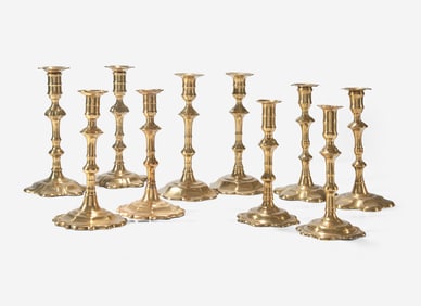 A group of ten George II scallop or petal-base brass candlesticks, England, 18th century