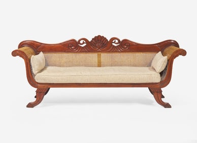 An Anglo-Colonial carved hardwood and caned sofa, first half 19th century