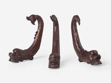 A group of three Classical carved mahogany dolphins, possibly Philadelphia, PA, circa 1820-1830