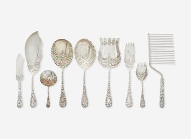 An assembled group of nine sterling silver floral repousse serving utensils, various makers,