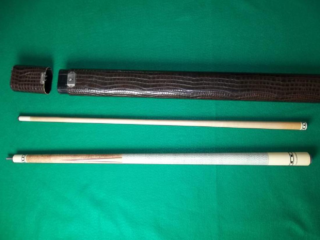 Meucci Originals Pool Cue, 2 piece, 58", slight: Meucci Originals Pool Cue, 2 piece, 58", slight staining on butt near bumper, hard brown 2 pc.Viking faux snakeskin style case, some dings in case, 31" l,staining on butt near bumper, hard brown 2 pc.