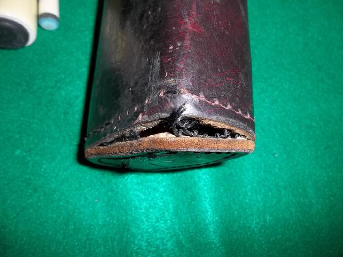 Joss Pool Cue, 3 piece, 1 butt with pearl inlay,: Joss Pool Cue, 3 piece, 1 butt with pearl inlay, 2 shafts, one shaft has wooden screw off cap, one shaft is discolored, 58", in hard brown leather case with handle, end of case has come unstitched, 33