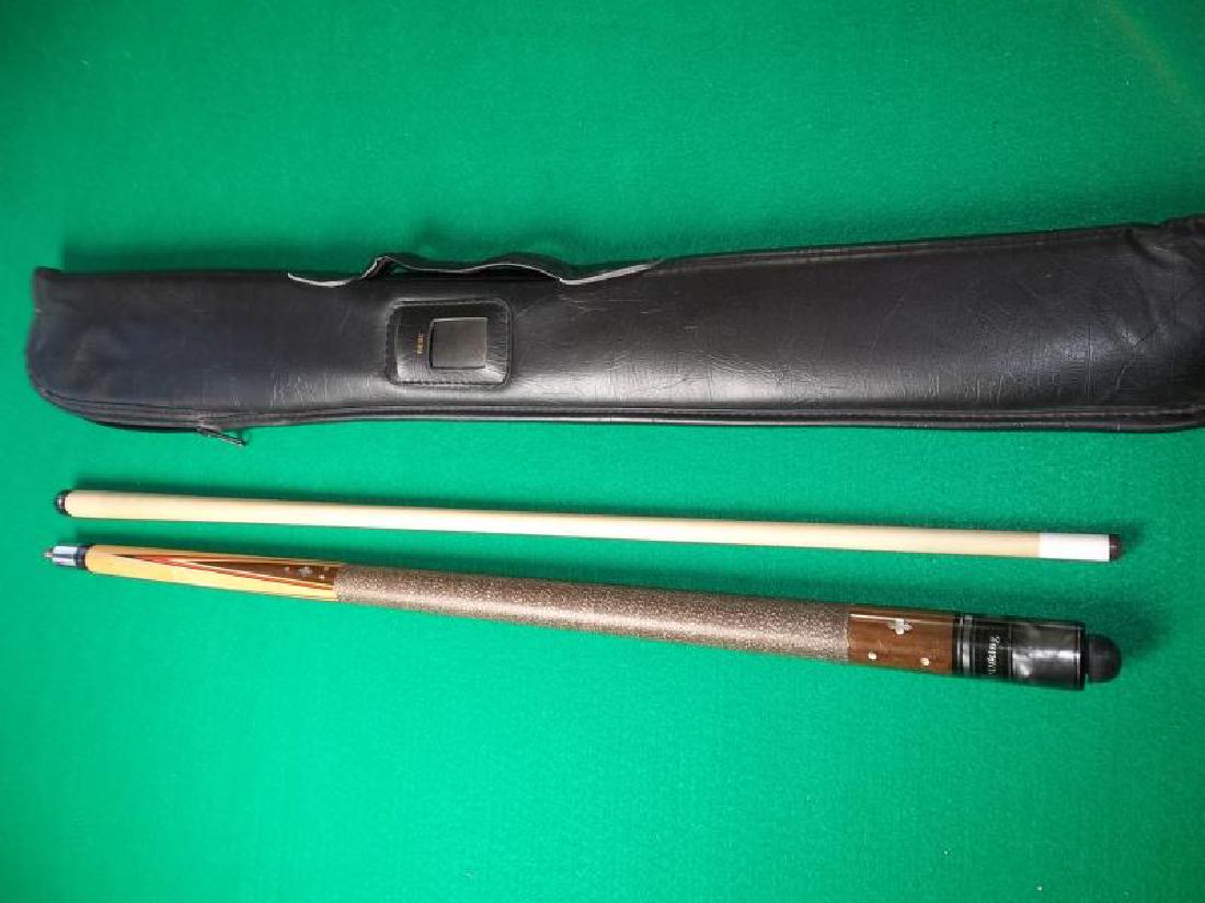 Viking Pool Cue, 2 piece, 58.5", Viking in clear: Viking Pool Cue, 2 piece, 58.5", Viking in clear window, pearl inlay, 4 point, dents on butt sleeve, discolor on forearm and ferrule, soft black Viking case with handle, 33" l,window, pearl inlay, 4 p