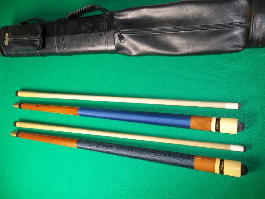 2 Viking Pool Cues, 2 butts, 2 shafts, 57" each,: 2 Viking Pool Cues, 2 butts, 2 shafts, 57" each, with Viking in clear window, discolored butt sleeve, one bumper is cracked, dents and scratches on both forearms, collars discolored and scratched, rin