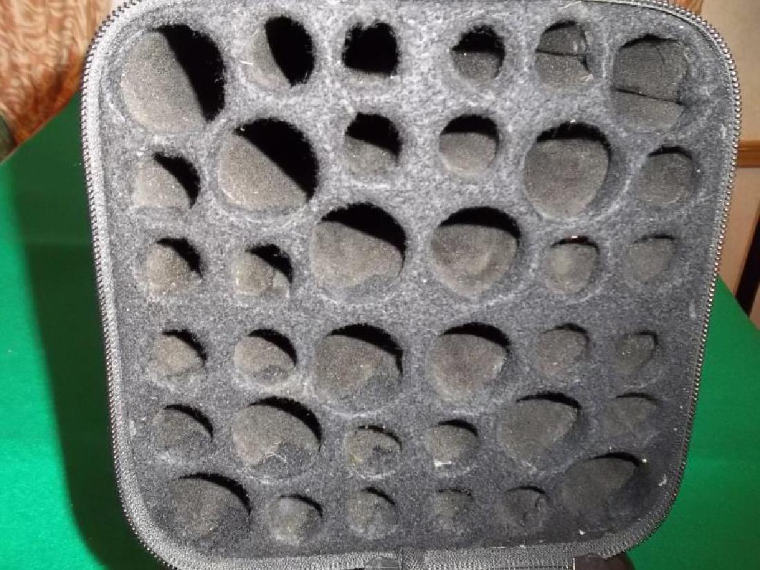 1 Case, hard black square case, holds 12 butts: 1 Case, hard black square case, holds 12 butts and 24 shafts, with strap and handle, tear in case, worn, 7" square x 33.5" l,and 24 shafts, with strap and handle, tear in case, worn, 7" square x 33.5"