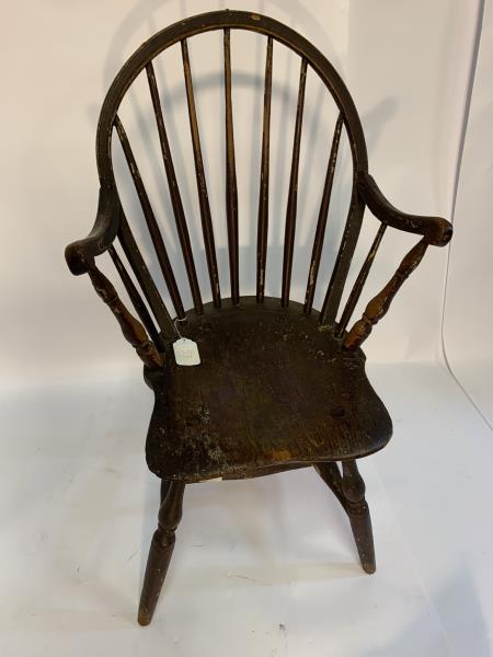 Windsor Arm Chair painted brown, center spindle: painted brown, center spindle repaired, seat cracked, finish poor, chips, 36" to top of back and 17" to top of seat