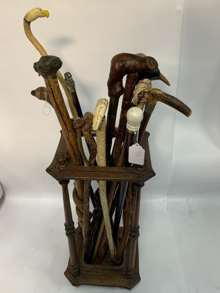 15 Canes in Victorian Oak Umbrella Stand,: dog, eagle, Columbus, eagle sword, horn, vertebrae and others