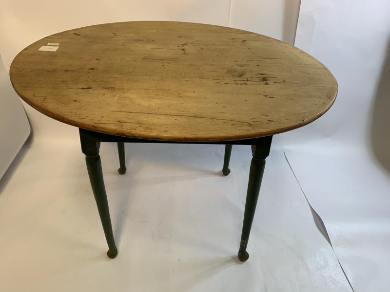 Tap Table oval, green, pad foot, natural wood top with: oval, green, pad foot, natural wood top with plugged holes, 26" t x 35" x 29" top