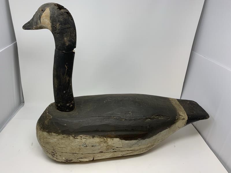 Canadian Goose Decoy stamped Dewey?? On top, neck: stamped Dewey?? On top, neck repairs and nailed, paint loss, cracks, 18" x 24" x 8 1/2" wide
