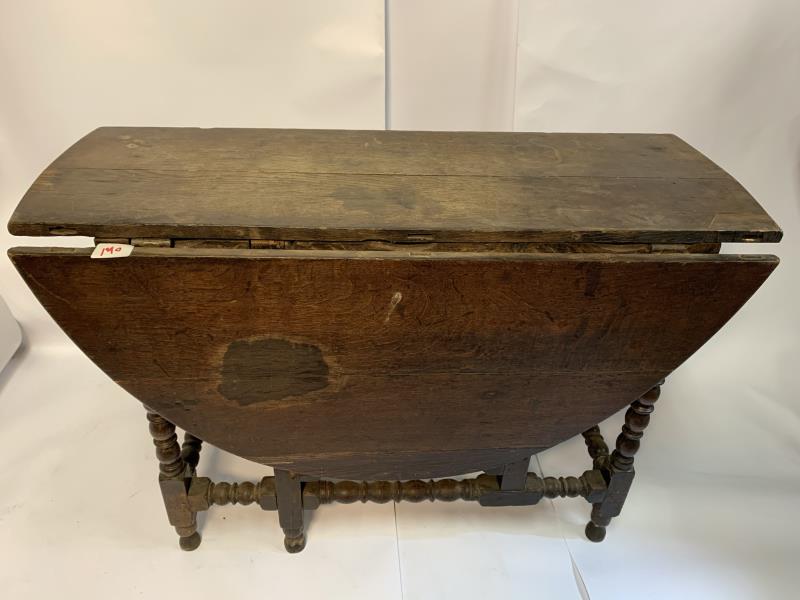 Drop Leaf Oak Table , turned, top has a 2" x 4" pieced: , turned, top has a 2" x 4" pieced repair, cracks and stained, 29 1/2" t x 44 1/2" x 52 1/2" top